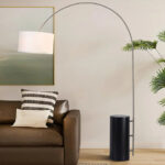 Palos Verdes Arc Floor Lamp with Sculpted Wood Base and Linen Shade by Nova of California.