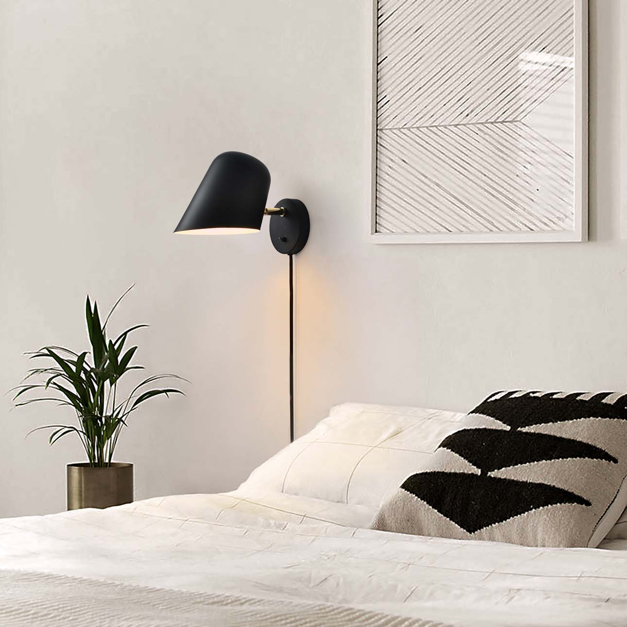 Chic Culver Wall Sconce in Matte Black: Adjustable shade for focused lighting. Glare-free LED illumination. Modern and versatile design by Nova of California