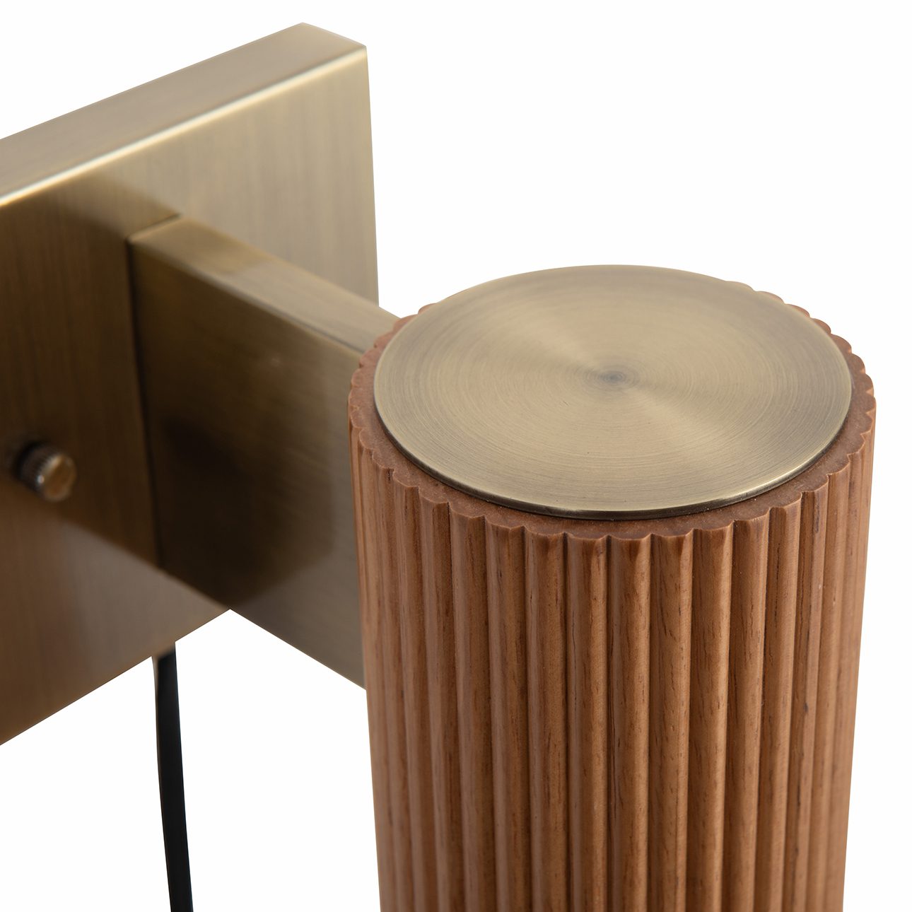 Tambo Wall Sconce in Ash and Brass with Warm Ambient Glow
